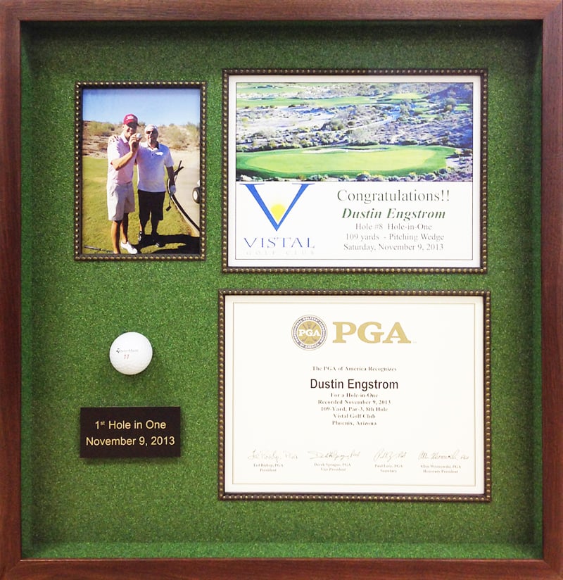 Custom framed hole-in-one golf ball, photo, and certificate framed in a modern mahogany shadowbox with green astroturf matting and customized nameplate Hall of Frames Arizona