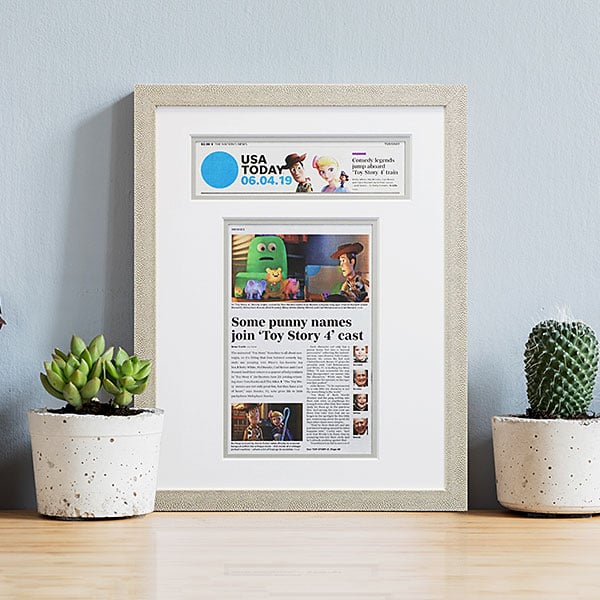 custom frame newspaper article framed in modern Roma Moulding pebbled cream frame with cream mat Hall of Frames Arizona