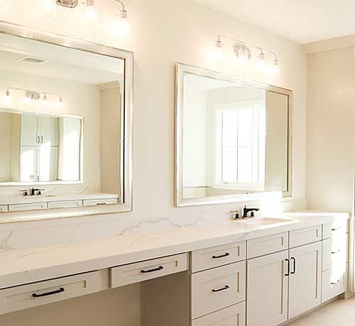 Home builders white bathroom in new home commercial Hall of Frames Arizona