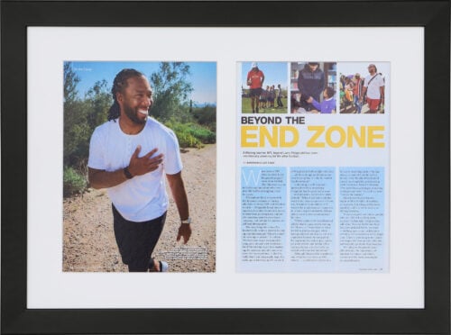 A photo of a custom framed two page spread magazine article from Hall of Frames