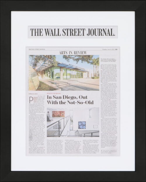 A photo of a custom framed Wall Street Journal newspaper article with a headline cutout from Hall of Frames.