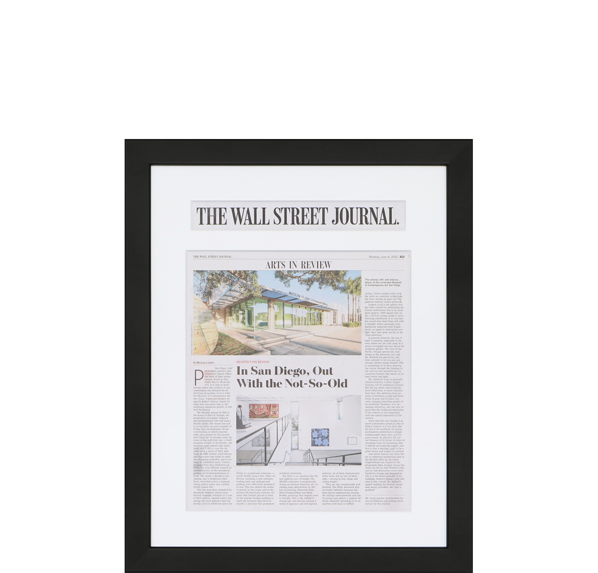 A photo of a custom framed newspaper article with a custom headline cutout from Hall of Frames.