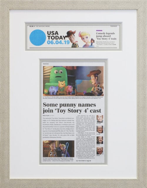 A photo of a custom framed USA Today newspaper article from Hall of Frames.