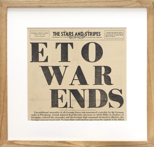 A photo of a custom framed newspaper article about War Ending from Hall of Frames.