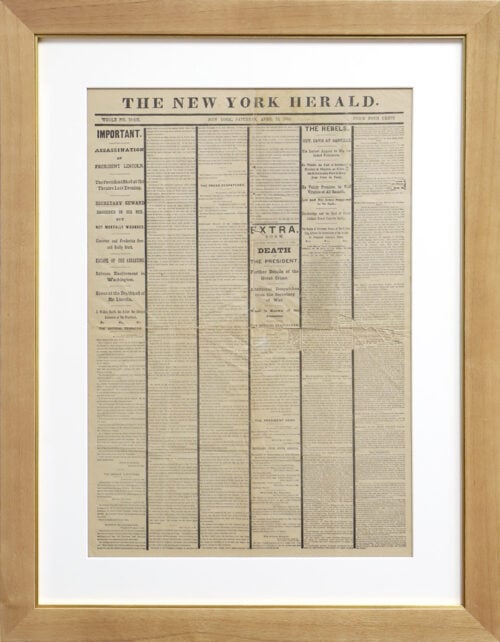A photo of a custom framed newspaper article about the Lincoln Assassination from Hall of Frames.