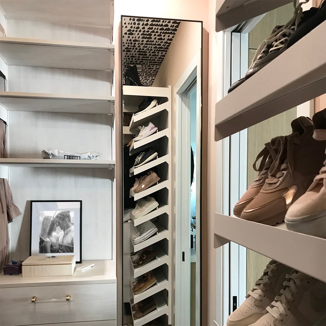 Photo of a custom framed mirror in a closet