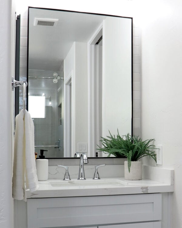 Infinity Black Framed Mirror in Neutral, White Bathroom with Single Vanity