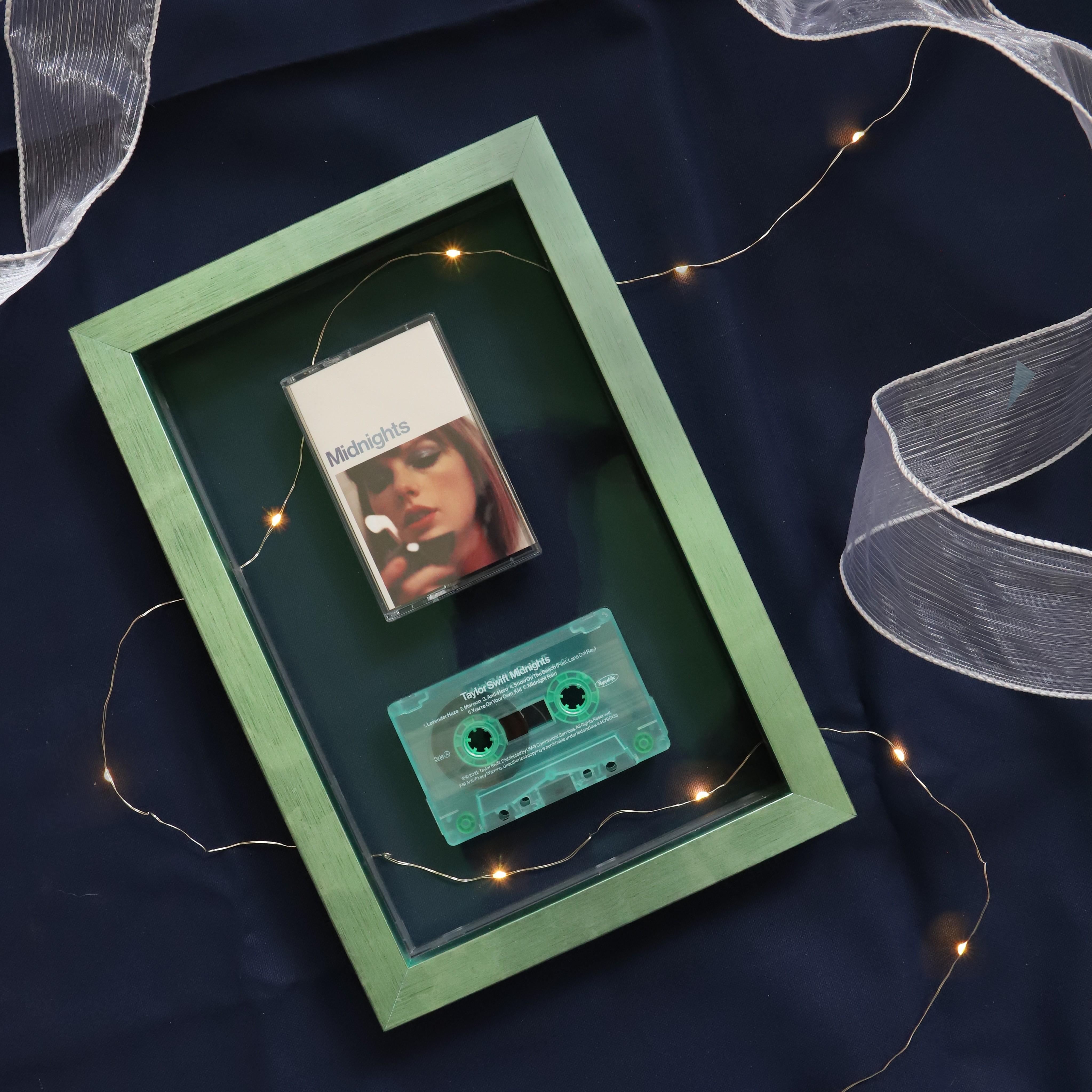 A photo of a Taylor Swift Cassette Framed in an Acrylic Float by Hall of Frames