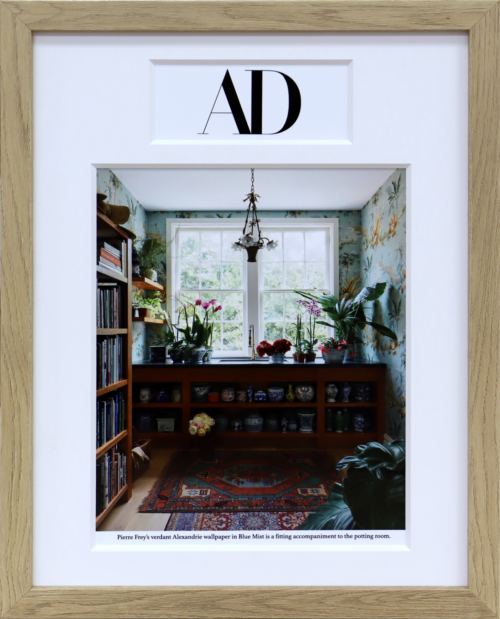 A photo of a custom framed Architectural Digest magazine cover by Hall of Frames
