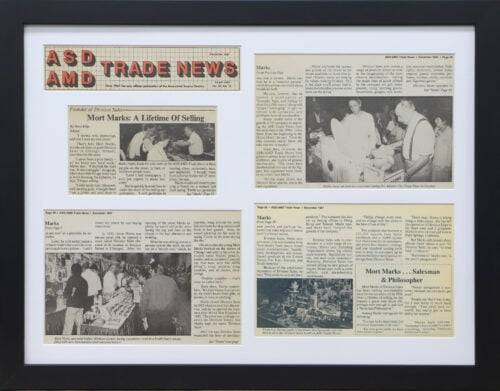 A photo of a custom framed trade news newspaper article by Hall of Frames.