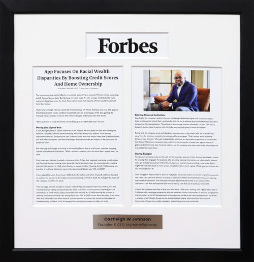 A photo of a custom framed  Forbes online article two page spread with engraved plate framed by Hall of Frames