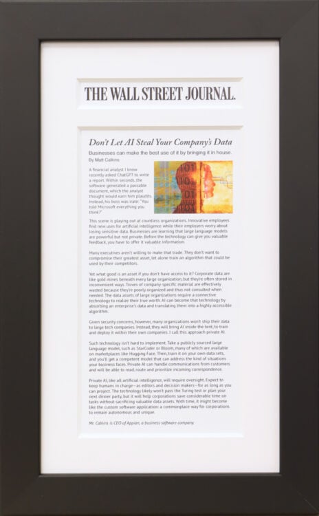 A photo of a custom framed Wall Street Journal online article framed by Hall of Frames