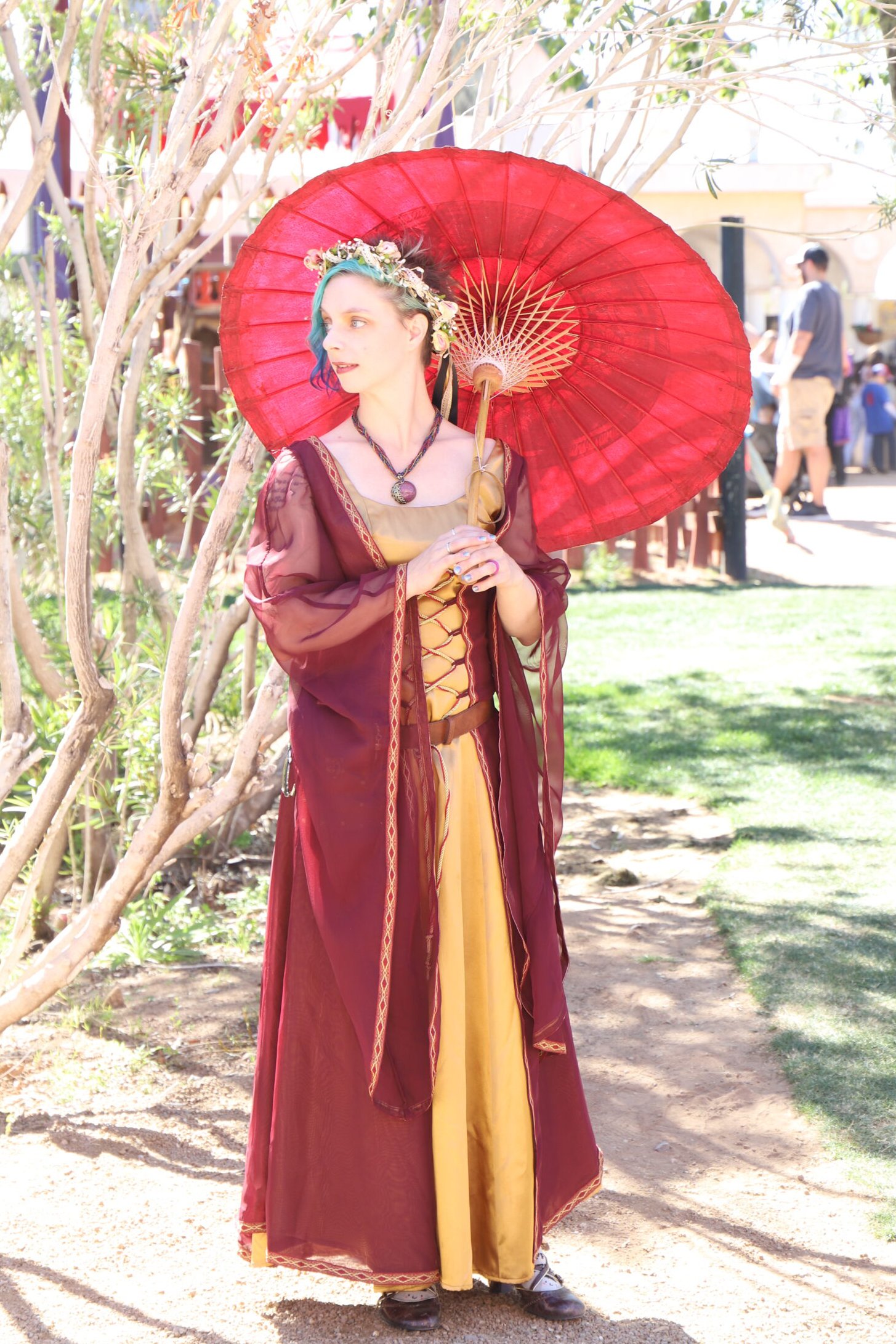 A photo of woman in a red dress at Arizona Ren Fest.