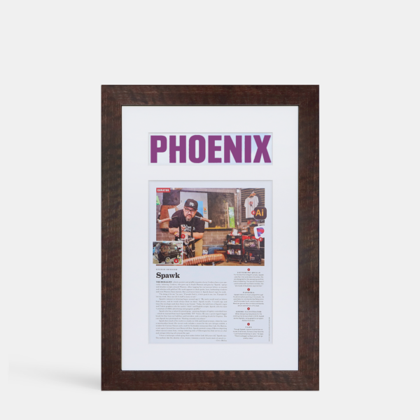 A photo of a framed magazine cover with a title headline cutout from Hall of Frames Arizona.