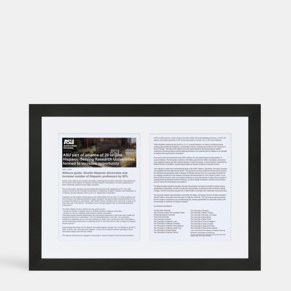 A photo of a custom framed double page digital article with headliner by Hall of Frames.