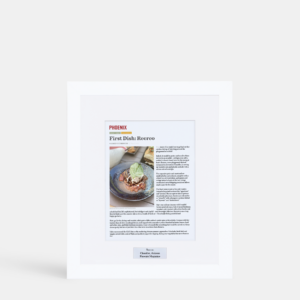 A photo of a custom framed digital article with an engraved plate by Hall of Frames.