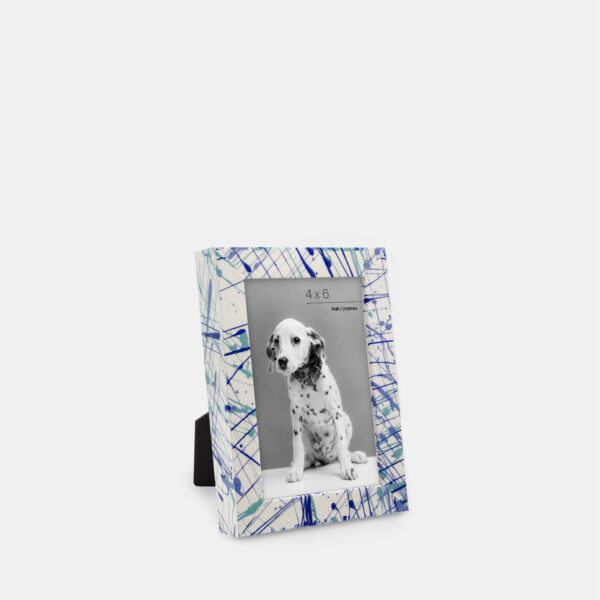 A paint splatter frame in the color Azure Flow featuring a photo of a Dalmatian puppy.