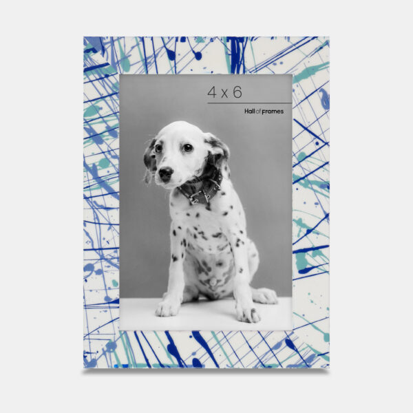 A paint splatter frame in the color Azure Flow featuring a photo of a Dalmatian puppy.