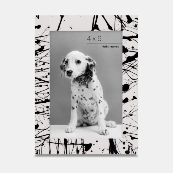 A paint splatter frame in the color Metro Fade featuring a photo of a Dalmatian puppy. 
