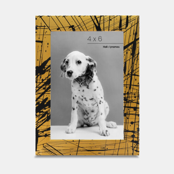 A paint splatter frame in the color Oro Drip featuring a photo of a Dalmatian puppy. 