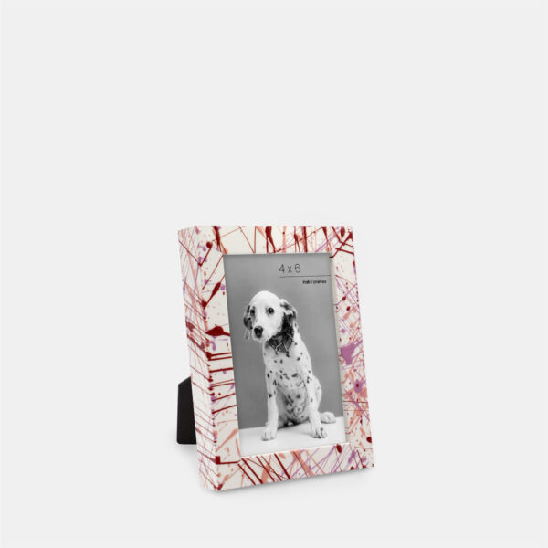 A paint splatter frame in the color Rebel Rose featuring a photo of a Dalmatian puppy. 