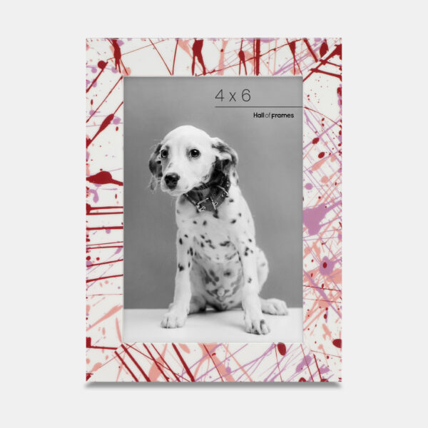 A paint splatter frame in the color Rebel Rose featuring a photo of a Dalmatian puppy. 