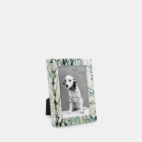 A paint splatter frame in the color Verde Mint featuring a photo of a Dalmatian puppy. 