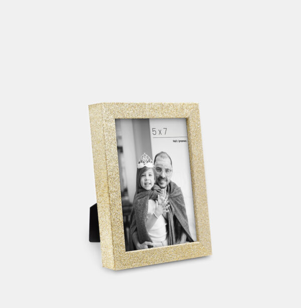 A gold colored sparkly, glitter frame containing a playful photo of a father and daughter.