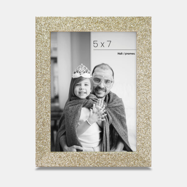 A gold colored sparkly, glitter frame containing a playful photo of a father and daughter.