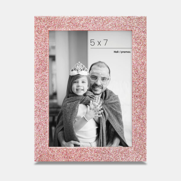 A rose colored sparkly, glitter frame containing a playful photo of a father and daughter.
