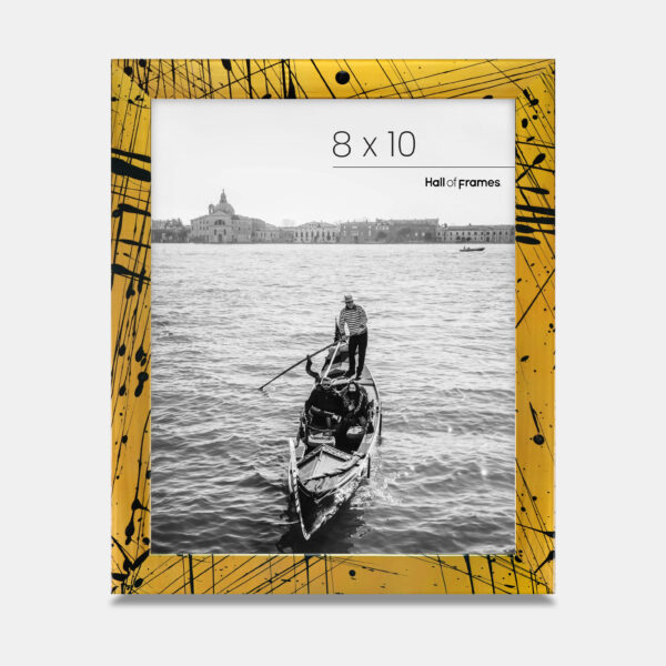 A paint splatter frame in the color Oro Drip featuring a photo of a couple in a gondola. 