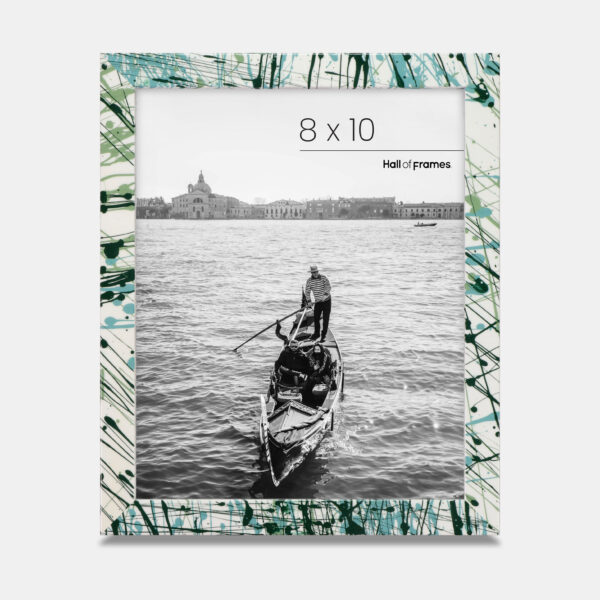 A paint splatter frame in the color Verde Mint featuring a photo of a couple in a gondola. 