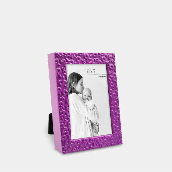 A purple frame featuring ribbons of strength serving a heartfelt tribute of love and support, bordering a photo with a mother and baby.