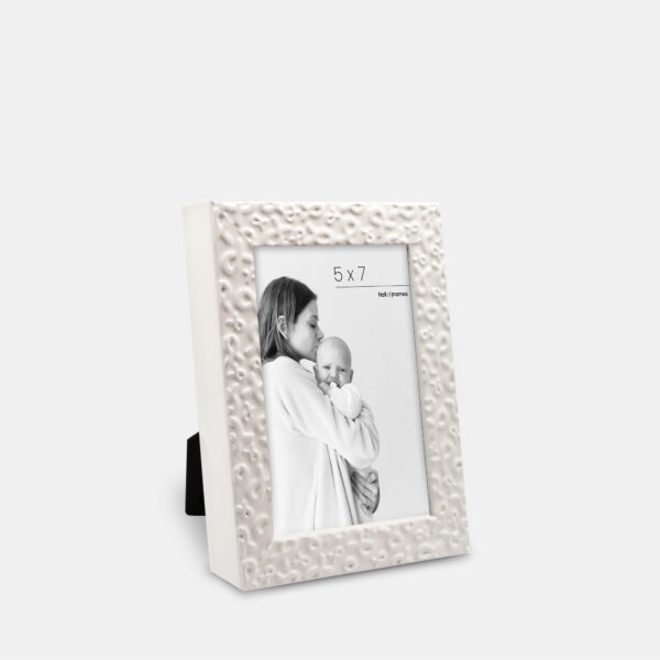 A white frame featuring ribbons of strength serving a heartfelt tribute of love and support, bordering a photo with a mother and baby.