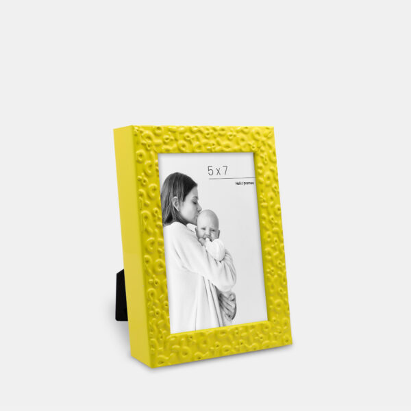 A yellow frame featuring ribbons of strength serving a heartfelt tribute of love and support, bordering a photo with a mother and baby.