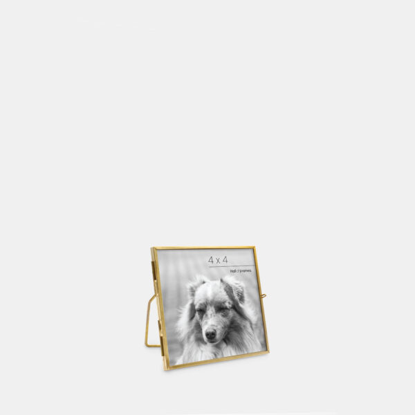 A 4x4 angled ultra-slim brass metal photo frame, crafted with sleek antique brass to frame any photo.