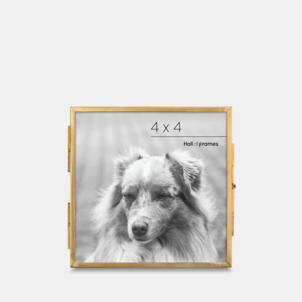 A 4x4 ultra-slim brass metal photo frame, crafted with sleek antique brass to frame any photo.
