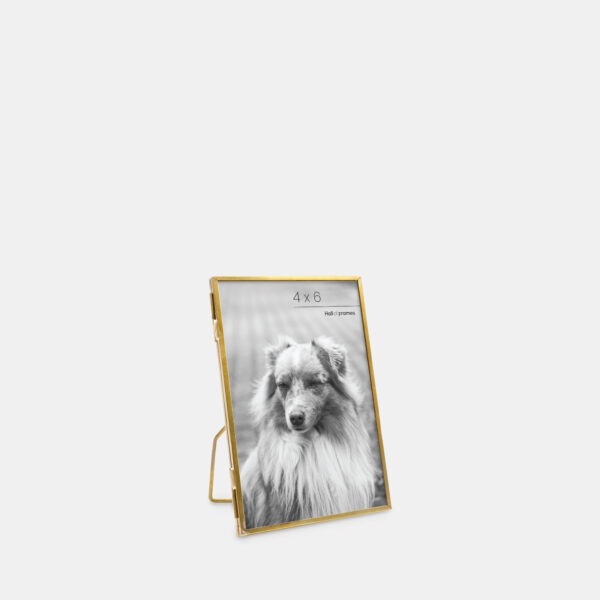 A 4x6 angled ultra-slim brass metal photo frame, crafted with sleek antique brass to frame any photo.