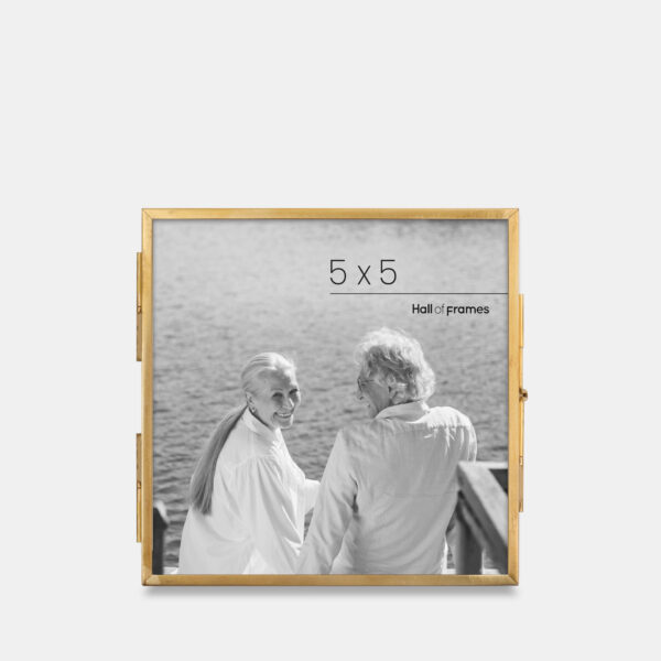 A 5x5 ultra-slim brass metal photo frame, crafted with sleek antique brass to frame any photo.