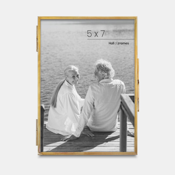 A 5x7 ultra-slim brass metal photo frame, crafted with sleek antique brass to frame any photo.