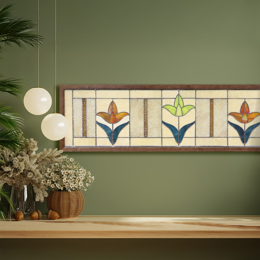 photo of a scene with a stained glass piece in a wooden frame