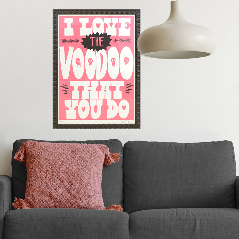 A scene of a pink poster in a readymade frame