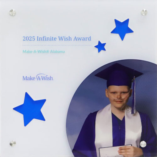 Acrylic 2025 Infinite Wish Award, Make-A-Wish Alabama, featuring a graduate photo and blue stars.