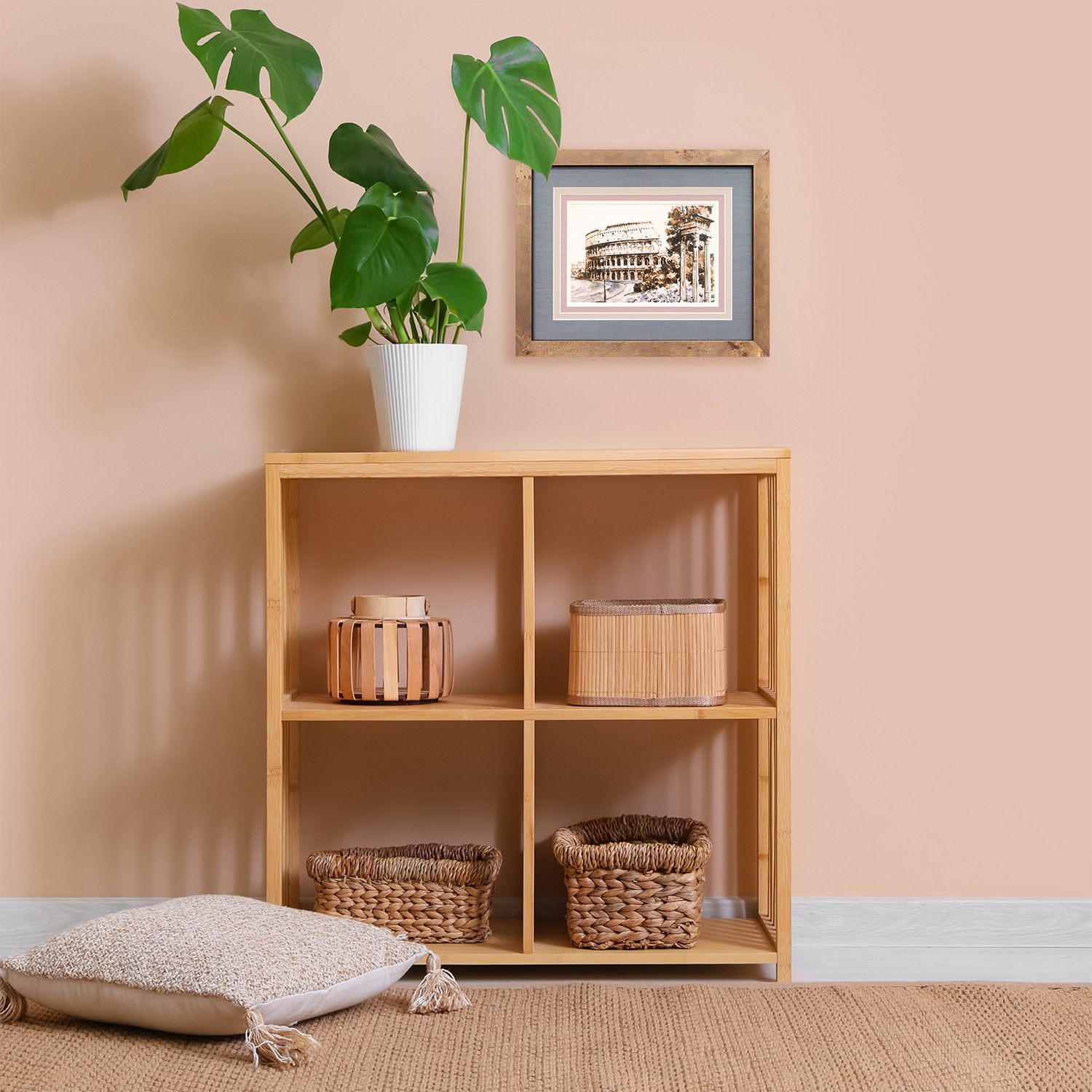Rustic wood frame with double matting displaying a sketch of the Roman Colosseum above a light bamboo shelf unit.