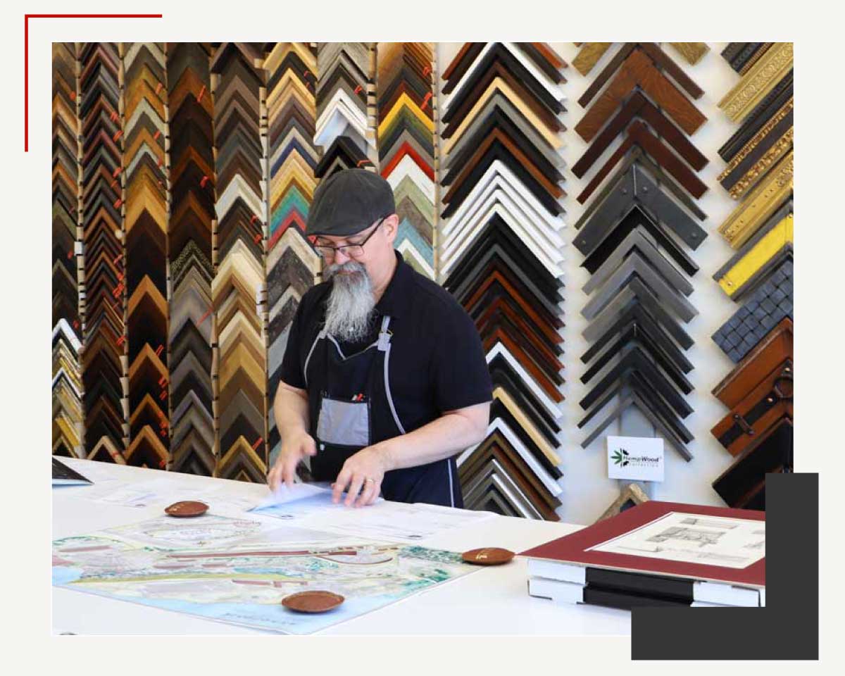 Employee designing a custom frame